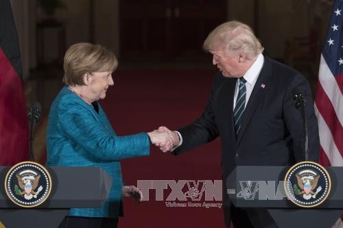 Deutsche Bundeskanzlerin und US-Präsident beim ersten Treffen - ảnh 1